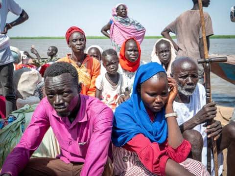 South Sudanese run away from their new nation