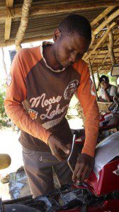 Hamisi Kanona repairs a bike