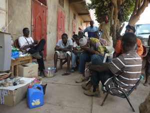 Unemployed men spend time on a street in Bamako (Photo Ilona Eveleens)