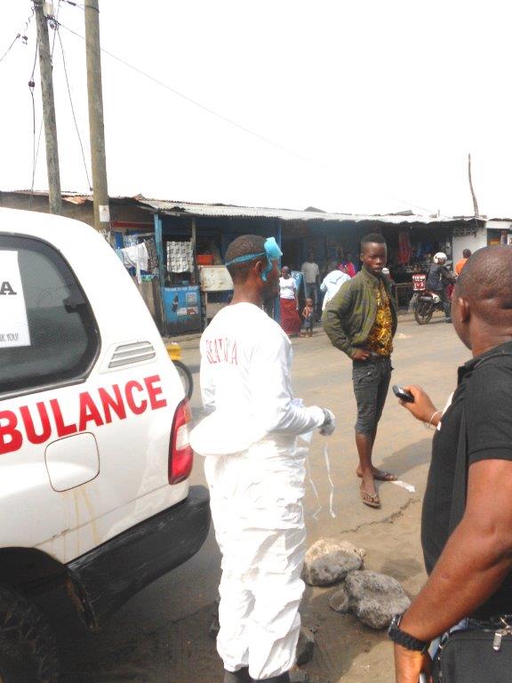 A suspected ebola carrier refuses to board an ambulance in West Point Monrovia 2014